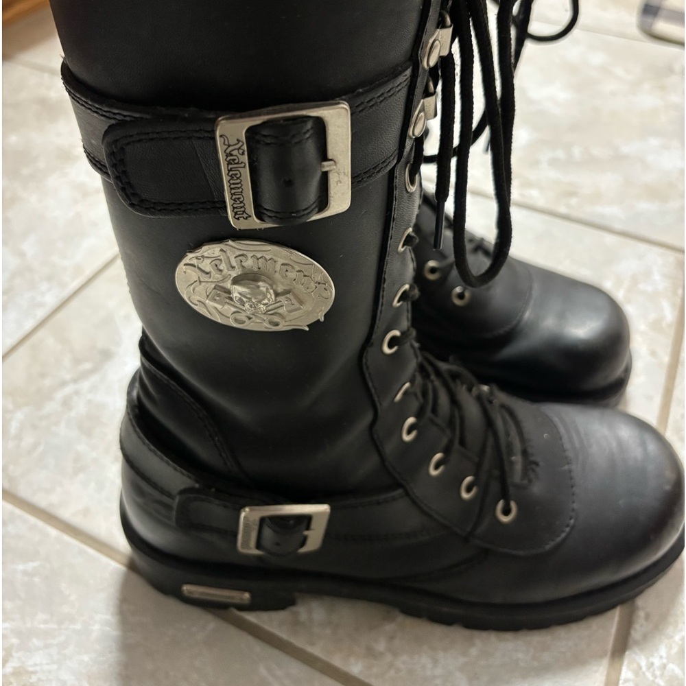 XElement laced riding boots. Zippered.